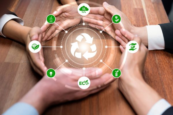 Business partnership hold Earth globe together with eco sustainability. Reliance Business partnership form circular hand together around recycle icon symbolize ESG sustainable environment and ecosystem protection with eco recycling technology and waste reduction. Reliance
